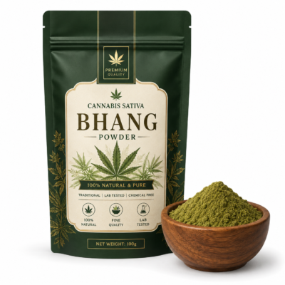 Organic cannabis sativa bhang powder in a resealable green pouch with a bowl of ground bhang on a wh.